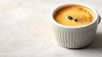An inviting espresso in a textured white cup exudes rich aromas in a serene setting photo