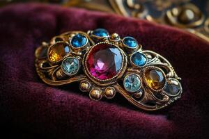 Macro photography of brooch with colorful vintage gemstones in ornate gold filigree setting on velvet fabric background photo