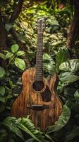 A guitar is sitting in the middle of some plants photo