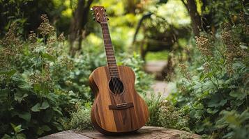 A guitar sits on a wooden stump in the woods photo