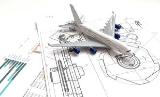 Image of passenger airplane and engineering blueprint photo