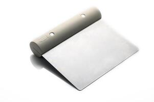 Innovative design of a sleek, minimal notebook resting on a smooth surface with natural lighting photo