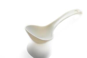 Creative kitchen utensil floats gently in soft light, enhancing culinary ambiance in a modern setting photo