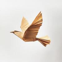 Origami bird crafted from brown paper flutters gracefully in mid-air with detailed wings and body structure photo