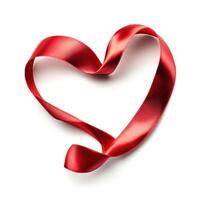 Red ribbon forms a heart shape on a plain background to symbolize love and affection in various contexts photo