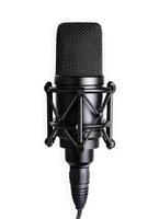High-quality black microphone placed on a studio stand ready for recording music or voiceovers in a professional setting photo