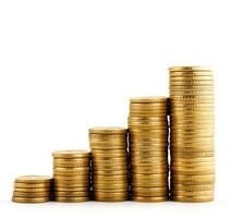 Stacked gold coins showing financial growth and investment over time in a minimalist style with white background photo