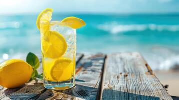 Refreshing lemonade with lemon slices by beach photo