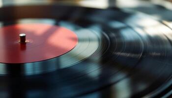 Spinning Vinyl Record with a Red Label Under a Beam of Sunlight photo
