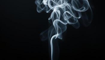 Wisps of ethereal smoke gracefully dance and curl against a stark black canvas creating a mesmerizing abstract visual photo