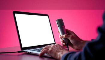 Recording a Podcast or Livestream with Microphone and Laptop in Studio Setup photo