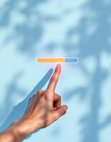 Interactive Progress Bar with Hand Touch Shadow and Light Blue Background photo