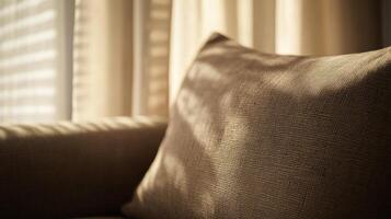 Comfortable beige cushion in sunlit room creating a warm ambiance photo