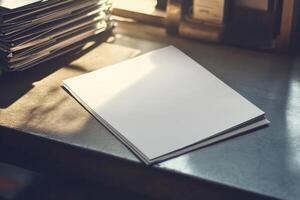 Stack of blank white papers on a wooden desk in sunlight reflecting ambient light photo