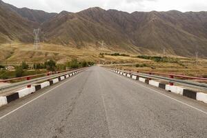 bridge over the Naryn river near the Toktogul reservoir on the Bishkek Osh highway in Kyrgyzstan. photo