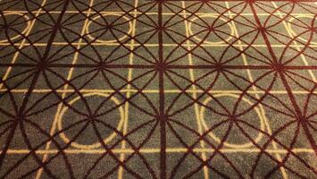 Texture, background, pattern. The fabric is brown with a red pattern. photo