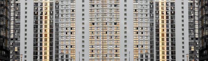 Urban window facade. Seamless pattern of a modern residential building with rows of identical photo