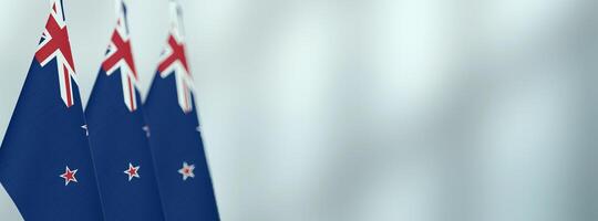New Zealand table flags in the office, banner background with space for text photo