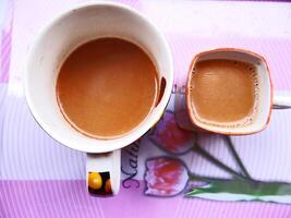 Two cups of coffee on a table photo