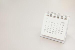 Simple desk calendar for JANUARY 2025 background. Calendar concept with copy space. 2025 JAN calendar. photo