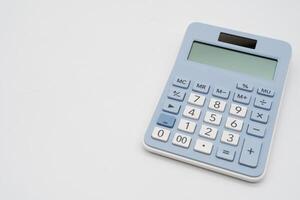 Light blue digital calculator on isolated background. Device for calculating the numbers. Copy Space. photo