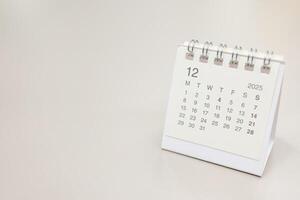 Simple desk calendar for 2025 DECEMBER background. Calendar concept with copy space. 2025 DEC calendar. monthly calendar. photo