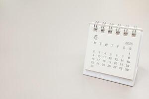 Simple desk calendar for 2025 JUNE background. Calendar concept with copy space. 2025 JUN calendar. monthly calendar. photo