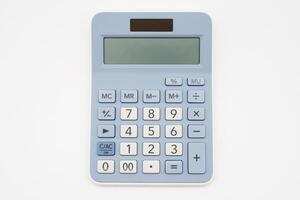 Light blue digital calculator on isolated background. Device for calculating the numbers. photo