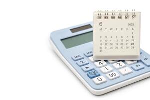 Simple desk calendar for 2025 JUNE on calculator. Calendar concept with copy space. 2025 JUN calendar. calculator and forecast for finances in 2025. photo