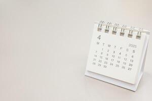 Simple desk calendar for 2025 APRIL background. Calendar concept with copy space. 2025 APR calendar. APRIL. photo