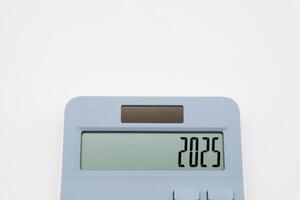 Calculator and forecast for finances in 2025. Money, Budget, tax, investment, financial and savings. calculator with 2025 numbers. photo