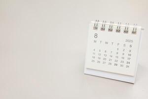 Simple desk calendar for 2025 AUGUST background. Calendar concept with copy space. 2025 AUG calendar. minimal calendar AUG. photo