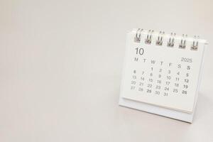 Simple desk calendar for 2025 OCTOBER background. Calendar concept with copy space. 2025 OCT calendar. monthly calendar. photo