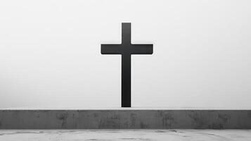 A black cross is standing on a concrete slab photo