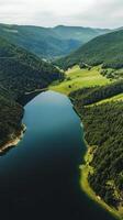 A lake is surrounded by trees and mountains photo