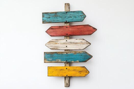 Colorful Rustic Wooden Signpost with Multiple Directional Arrows on White Background photo