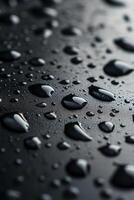 A close up of water droplets on a surface photo