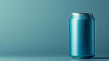 A can of soda is sitting on a table photo
