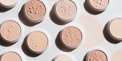 Compact powder arranged neatly on a white surface, with subtle shading. photo