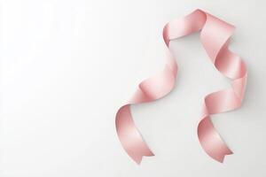 A pink ribbon is on a white background photo