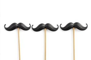 Three fake mustaches are on a white background photo
