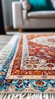A rug with a blue and white design sits on a wooden floor photo