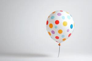Colorful Polka Dot Balloon on Minimalist Background for Celebrations and Parties photo