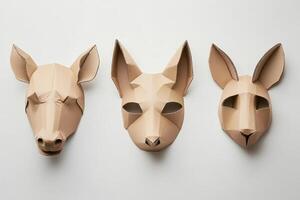 Three paper masks of animals, one of which is a rabbit photo