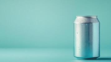 A can of soda is sitting on a blue background photo