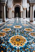 A long hallway with a blue and yellow tile floor photo