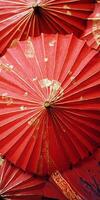 A group of red umbrellas with gold accents photo