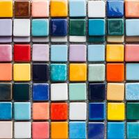 Colorful Mosaic Tiles in Various Shades and Textures Arranged in a Grid Pattern photo