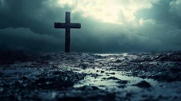 Dramatic Cross in Stormy Landscape with Dark Clouds and Reflections on Wet Ground photo