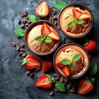Chocolate ice cream topped with fresh strawberries and mint photo
